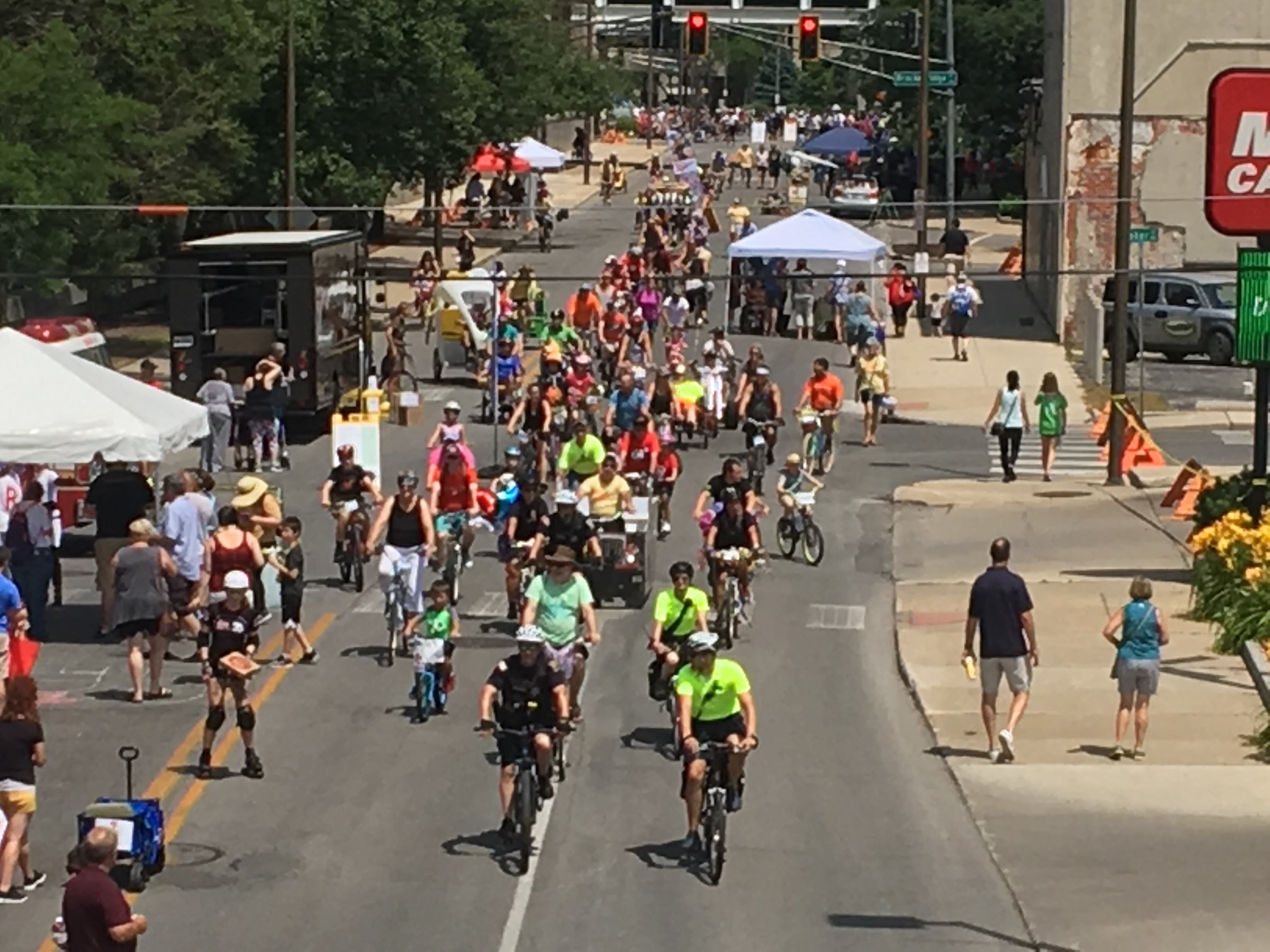 A group of bicyclists rides down the Open Streets route.